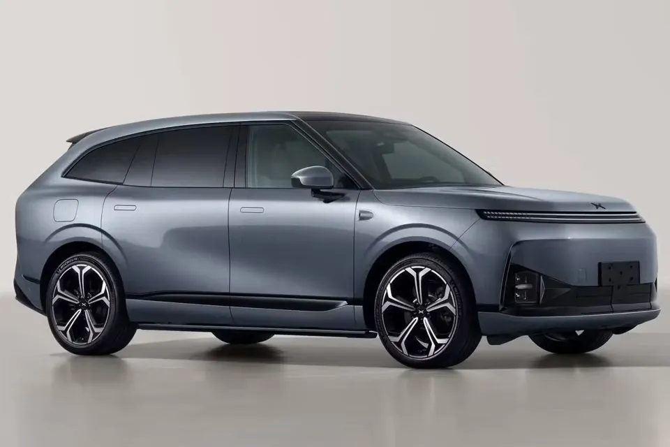 A grey XPeng G9L large electric SUV seen from the front three-quarter angle in a studio
