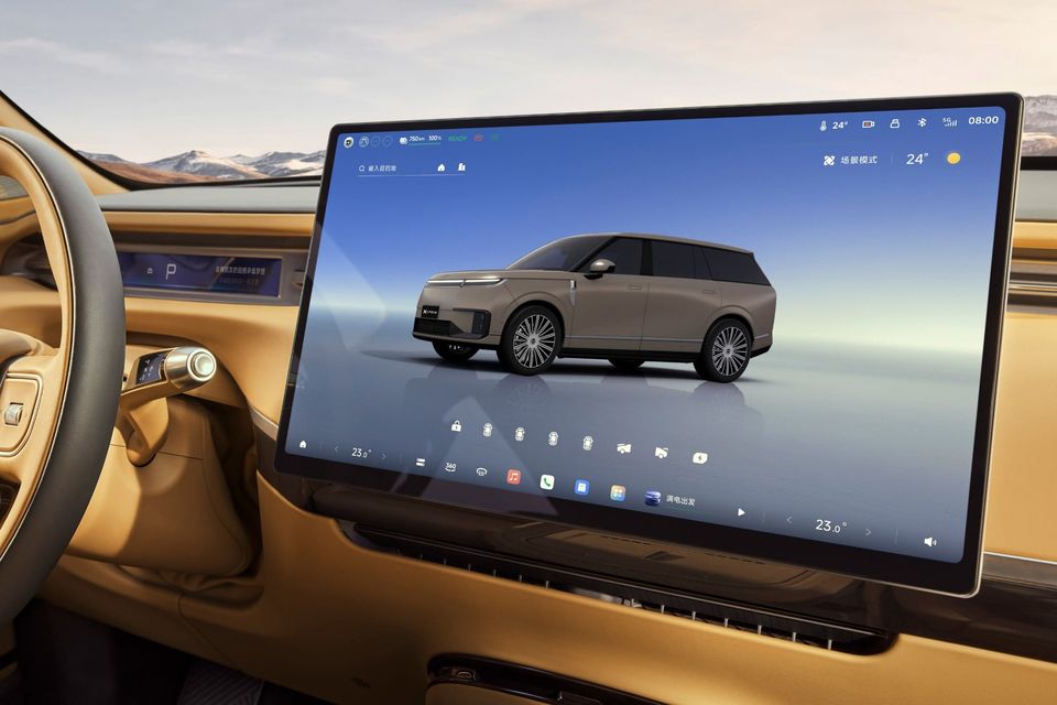 The large central touchscreen infotainment display inside an Xpeng G6 SUV, showing a 3D vehicle graphic and Chinese-language interface
