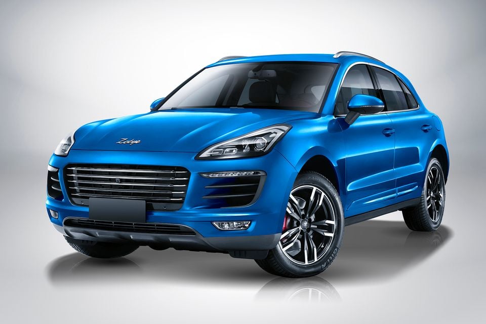 A blue Zotye SR9 SUV seen from the front three-quarter angle in a studio setting.
